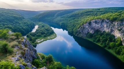 Breathtaking river winding through the lush green forests and cliffs in a peaceful natural environment : Generative AI