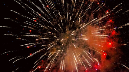 holiday flash of colorful fireworks in the black night sky