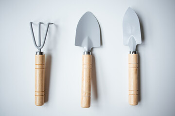 Garden hand tool set with wooden handles and metal heads