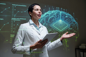 Waist up portrait of female scientist on stage giving presentation on brain implants during medical...