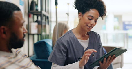 Healthcare, tablet and man consulting doctor in hospital for online, planning or surgery schedule...