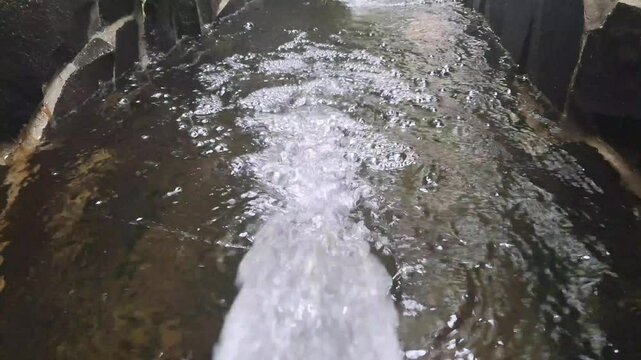 water fountain flowing into the pool