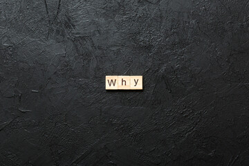 WHY word written on wood block. WHY text on cement table for your desing, concept