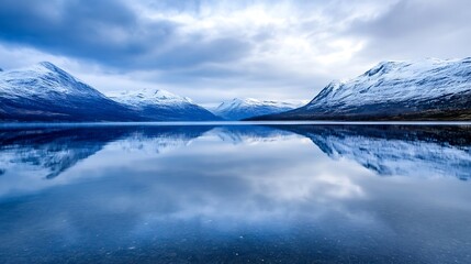 Breathtaking winter landscape with snowcapped mountains reflecting in serene lake waters : Generative AI