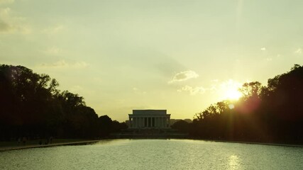 White House in Washington DC with American flag waving in the wind.