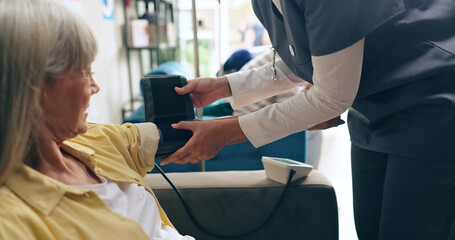 Woman, nurse and patient with blood pressure machine for heart rate or monitoring pulse at...