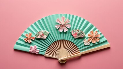  A beautifully crafted paper fan adorned with intricate floral designs