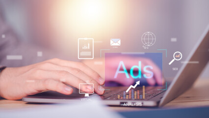 Marketers use laptops to analyze marketing strategies, modern marketing business ideas, use online technologies and advertising through websites and media, to plan future growth.