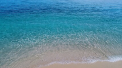 Fototapeta premium Aerial view of tranquil clear turquoise water gently washing onto a sandy beach : Generative AI