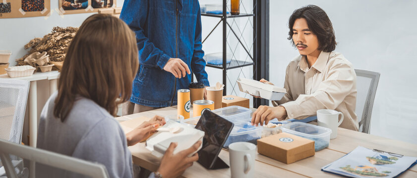 Young SME business asian people man woman team meeting with ESG green eco friendly recycle reduce reuse zero waste packaging in room office company