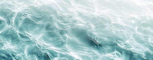 Obraz premium Gentle ripples of turquoise colored water create delicate patterns
