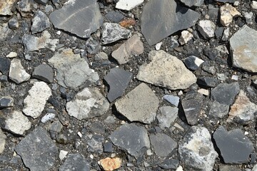 Mountain road gravel texture, sunlit, background blur