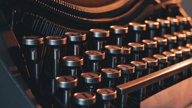 Close-up of vintage typewriter keys reveals their intricate design and aged metal shine. A warm, inviting workspace is enhanced by natural light and calming surroundings, perfect for typing.