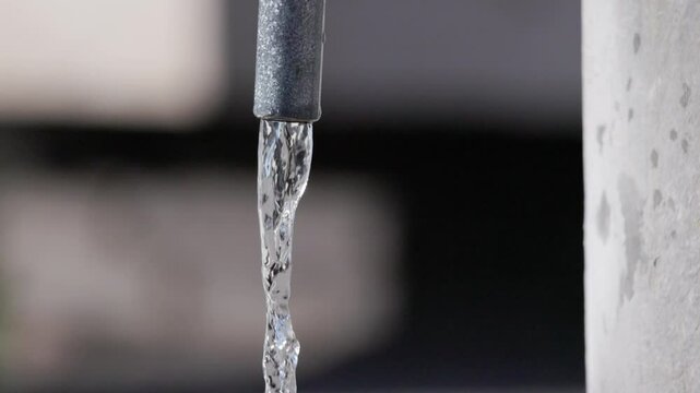 Slow Motion video of water flowing out of a nasone fountain in Rome - Italy