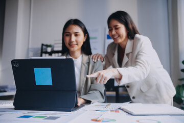 Group of Asian business people team meeting in modern office working design planning and ideas concept