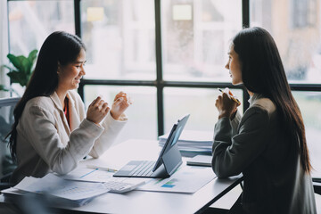 Group of Asian business people team meeting in modern office working design planning and ideas concept