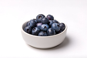 Bowl of Fresh Blueberries in a White Bowl on a White Background