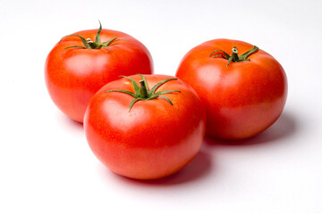 Three Tomatoes on White Background