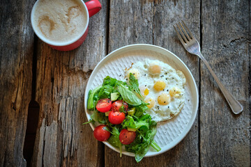fried quail eggs and Lettuce and Cherry Tomato Salad