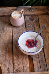 poppy seed rice pudding with cherry sauce.	