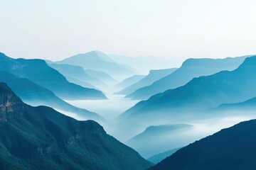 Naklejka premium A serene landscape featuring layered mountains shrouded in mist, creating a tranquil and ethereal atmosphere.