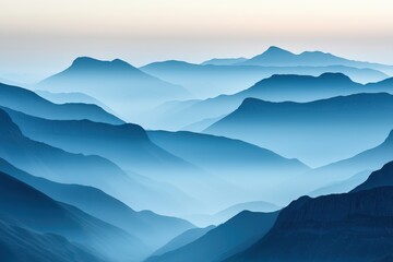 Fototapeta premium A serene view of layered blue mountains shrouded in mist, creating a tranquil and atmospheric landscape.