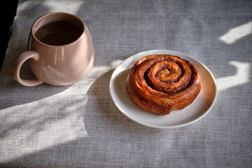 roll croissant on a white plate.