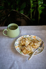 Syrniki with pear slices and nuts