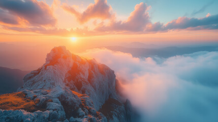 Fototapeta premium Majestic sunrise illuminates rugged mountain peaks and drifting clouds in a breathtaking natural landscape