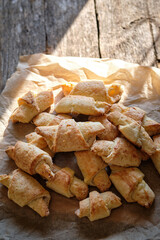 rolled cookies on a wooden board. close-up