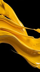Close-up view of bright yellow flowing paint on black background