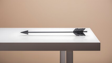 Arrow on white table and beige background