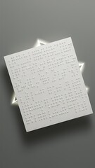 Close up view of braille text on white paper isolated on grey