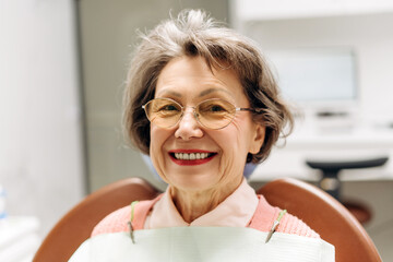 Elderly woman smiling during dental checkup