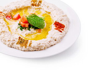 Delicious hummus with olive oil and fresh ingredients for dipping