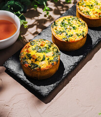 Savory spinach and cheese muffins on a serving platter