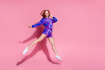 Photo of positive jump up running fast wear clothes isolated pastel color background