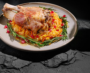 Savory roasted meat served on a plate with vegetables and herbs