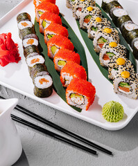 Assorted sushi platter on elegant white dish