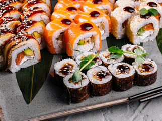 Assorted sushi set on elegant plate with soy sauce