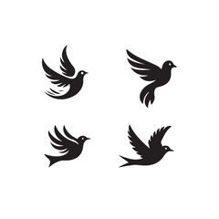 Obraz premium Four Black Silhouettes of Birds in Flight.This image features four stylized, black silhouettes of birds in flight.