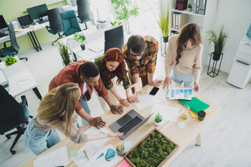 Photo of young age company colleagues diverse guys and girls cooperation at office ceo listening his team financial forecast