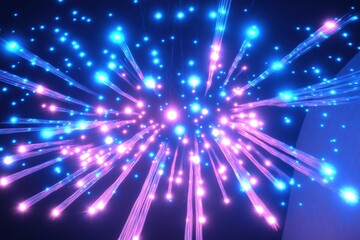 Obraz premium A vibrant display of colorful lights resembling fireworks, with blue and pink hues radiating outward against a dark background.