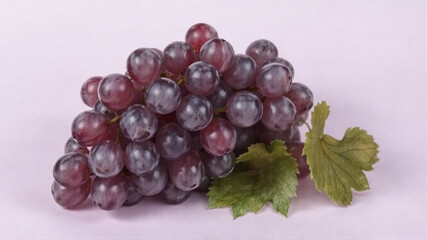 A bunch of grapes lies on a light purple background.