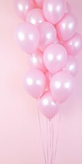  Light Pink Balloons with Shiny Metallic Finish Against a Soft Pastel Background