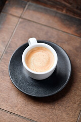 Cup of coffee on wooden background. Soft focus. Copy space	