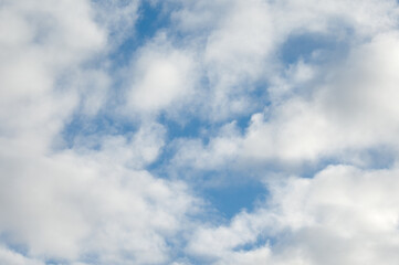 blue background, photo shows blue sky and white clouds