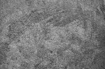 gray background, photo shows texture of old plaster on the wall of a building