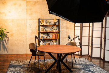 Podcast studio setup with microphones and furniture for engaging conversations