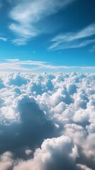Naklejka premium Beneath the vast expanse of a bright blue sky, soft, fluffy clouds float serenely. The view captures the calmness of a high-altitude journey, inviting daydreams
